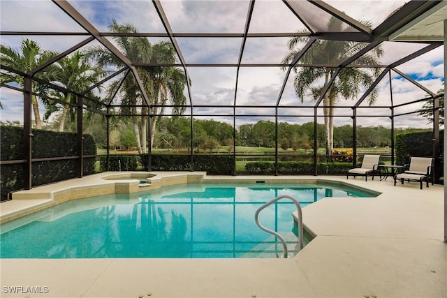 view of swimming pool featuring a lanai, an in ground hot tub, and a patio