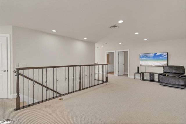 corridor with light colored carpet