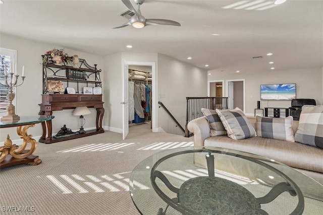 carpeted living room featuring ceiling fan