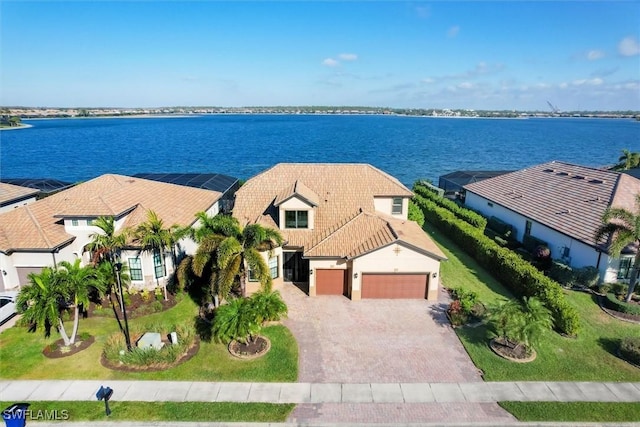 birds eye view of property with a water view