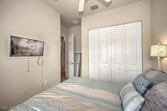 bedroom featuring ceiling fan and a closet