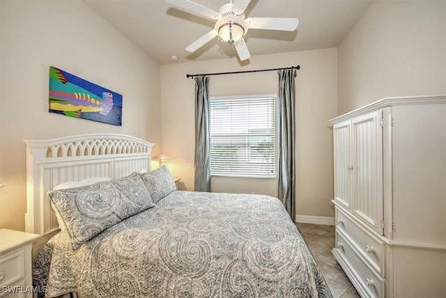 tiled bedroom with ceiling fan