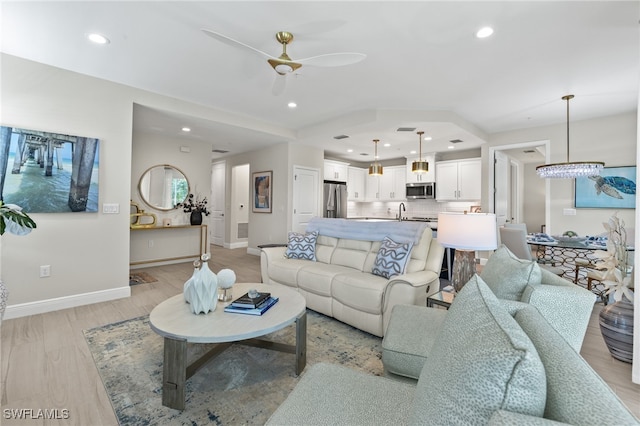 living room with ceiling fan, recessed lighting, visible vents, baseboards, and light wood finished floors