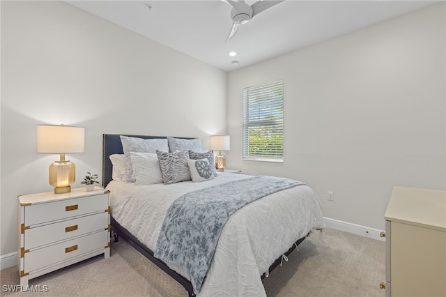 bedroom featuring recessed lighting, light carpet, and baseboards