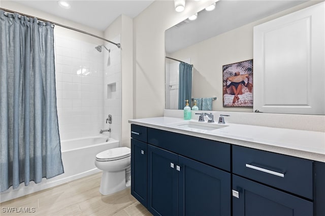 full bathroom with shower / tub combo, vanity, and toilet