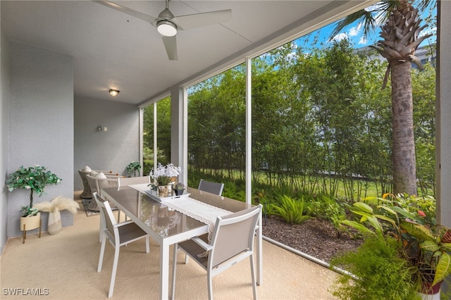 sunroom with a ceiling fan