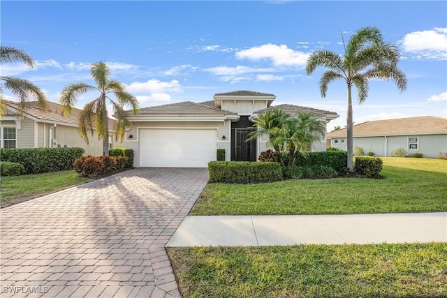 view of front of home featuring a garage and a front yard