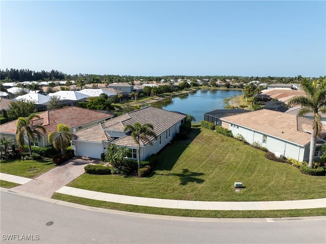 bird's eye view featuring a residential view and a water view