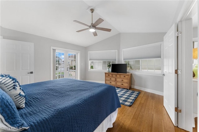 bedroom with access to exterior, hardwood / wood-style flooring, ceiling fan, and lofted ceiling