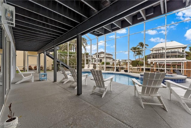 view of pool featuring an in ground hot tub and a patio