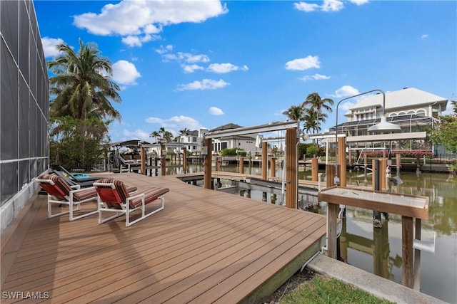 dock area featuring a water view and a lanai