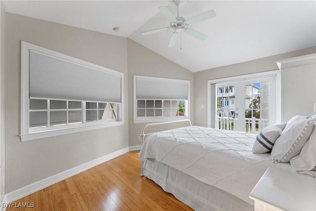 bedroom featuring access to exterior, ceiling fan, hardwood / wood-style floors, and lofted ceiling