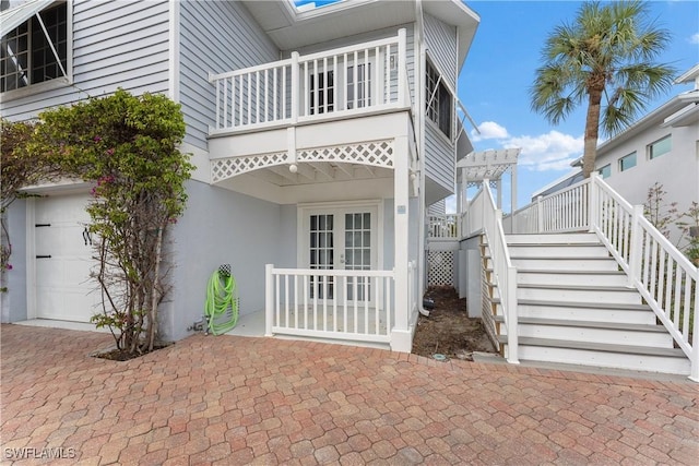 exterior space featuring french doors and a garage