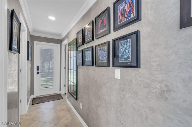 doorway featuring ornamental molding and light tile patterned flooring