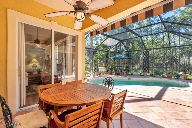 exterior space featuring a lanai, a patio area, and ceiling fan