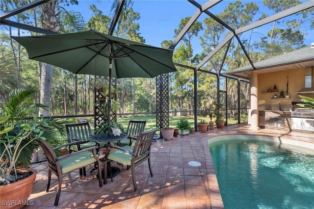 view of pool with a patio area, a lanai, and a grill