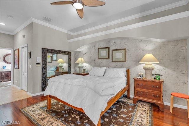 bedroom with ceiling fan, hardwood / wood-style floors, and ornamental molding