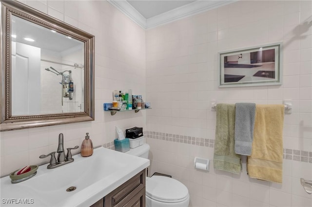 bathroom featuring vanity, toilet, crown molding, and tile walls