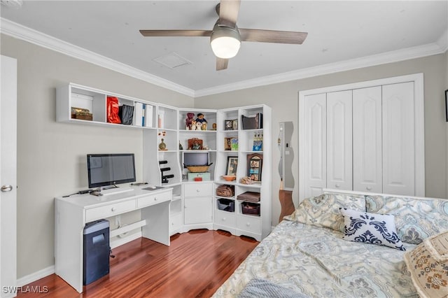 bedroom featuring a closet, ceiling fan, ornamental molding, and dark wood-type flooring