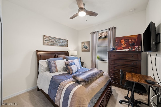 bedroom featuring ceiling fan and light carpet