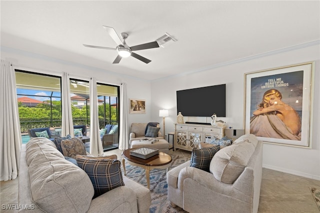 living room with ceiling fan and ornamental molding