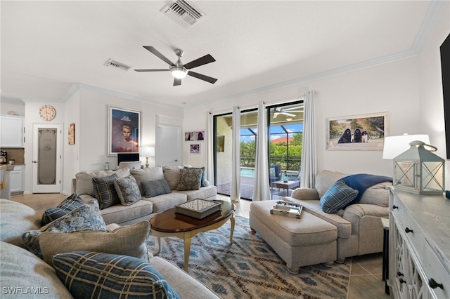 tiled living room featuring ceiling fan and crown molding