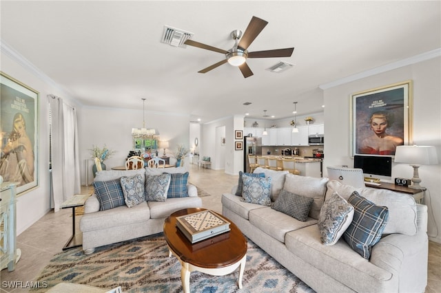 tiled living room featuring ceiling fan with notable chandelier and crown molding