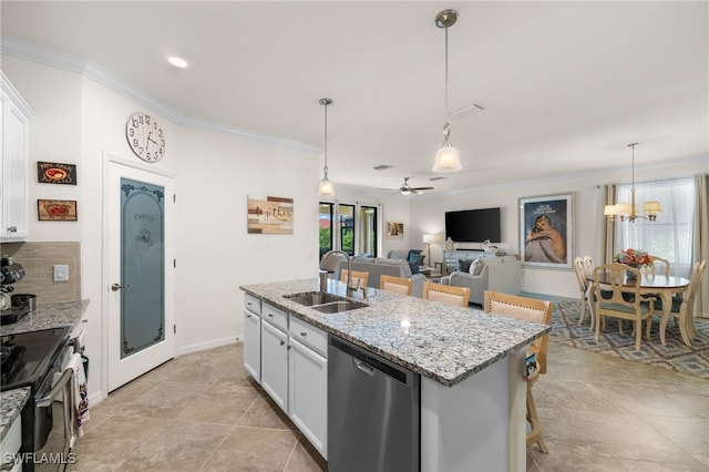 kitchen with white cabinetry, sink, stainless steel appliances, a kitchen bar, and ceiling fan with notable chandelier