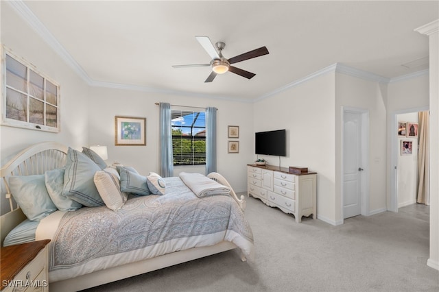 carpeted bedroom with ceiling fan and ornamental molding