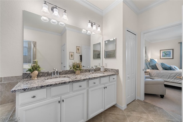 bathroom featuring tile patterned floors, vanity, and ornamental molding