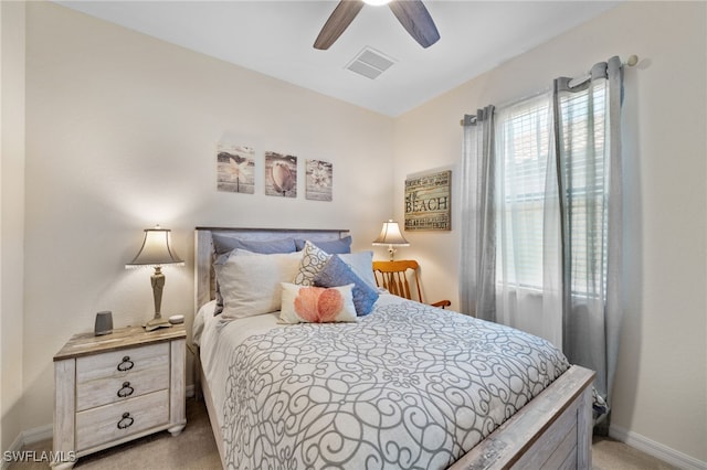 bedroom featuring ceiling fan and light carpet