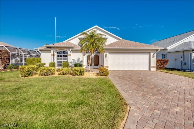 view of front of property with a front lawn and a garage