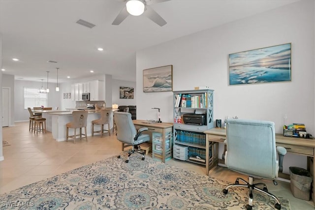 office space featuring ceiling fan and light tile patterned flooring