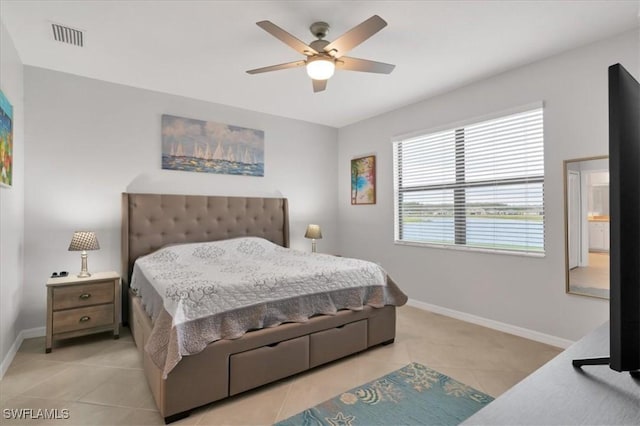 bedroom with light tile patterned floors and ceiling fan