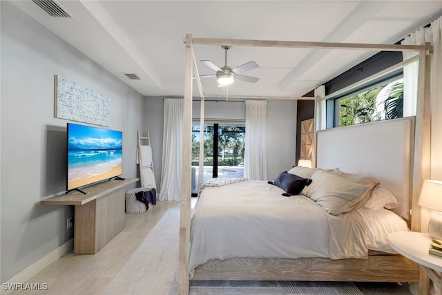 bedroom with multiple windows, access to outside, and ceiling fan