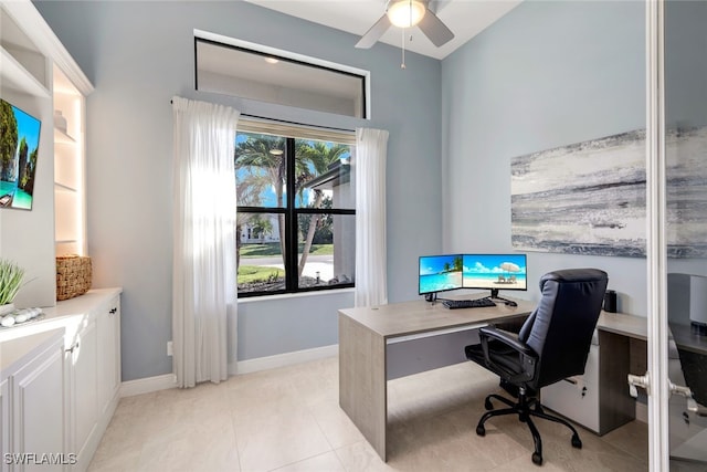 office area with ceiling fan and light tile patterned floors