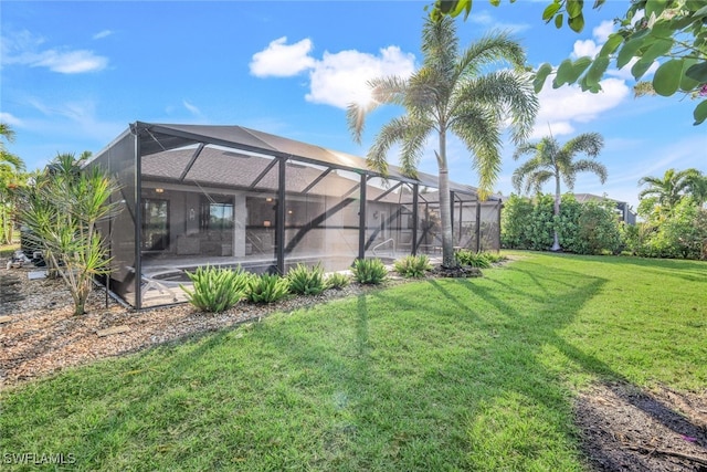 view of yard with glass enclosure