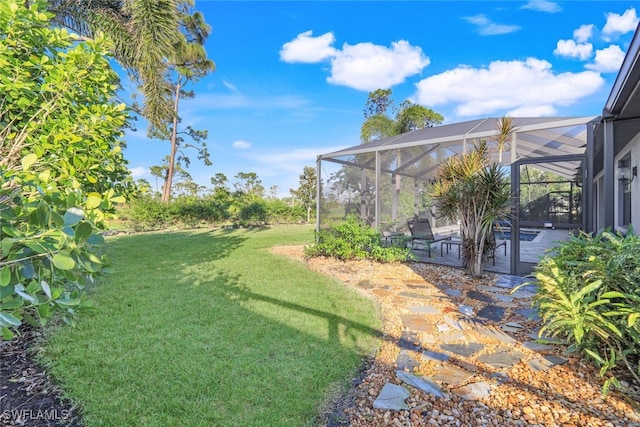 view of yard featuring a lanai and a patio area