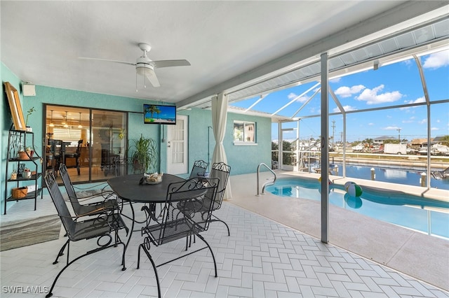 exterior space with ceiling fan and a swimming pool