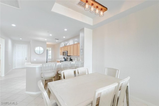 dining room featuring light tile patterned flooring