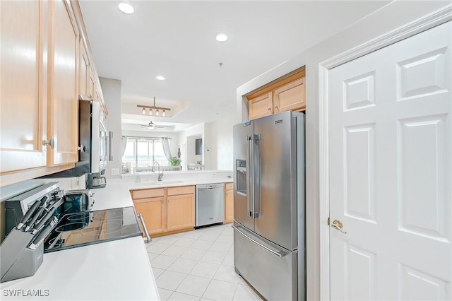 kitchen with appliances with stainless steel finishes, light brown cabinetry, ceiling fan, sink, and light tile patterned floors