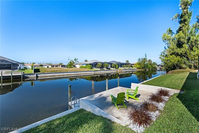 exterior space featuring a water view and a lawn