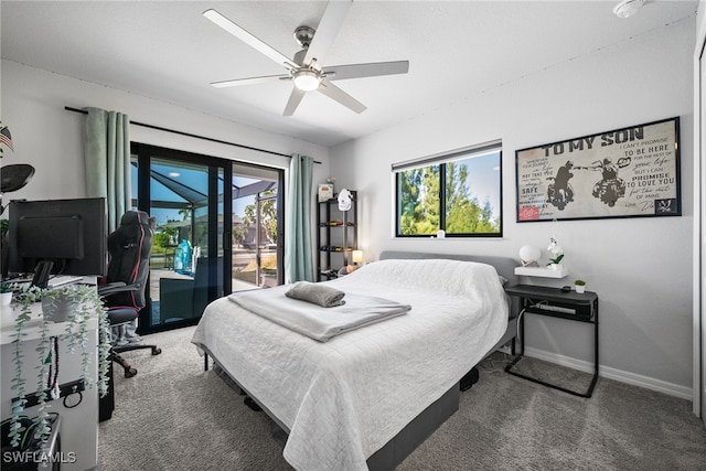 carpeted bedroom featuring ceiling fan, multiple windows, and access to outside