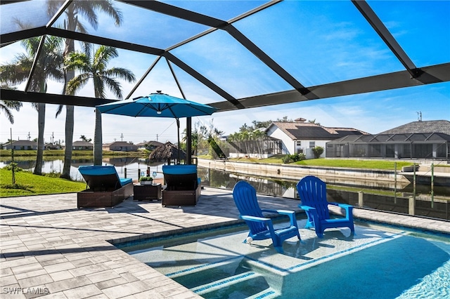 view of patio / terrace with a water view and glass enclosure