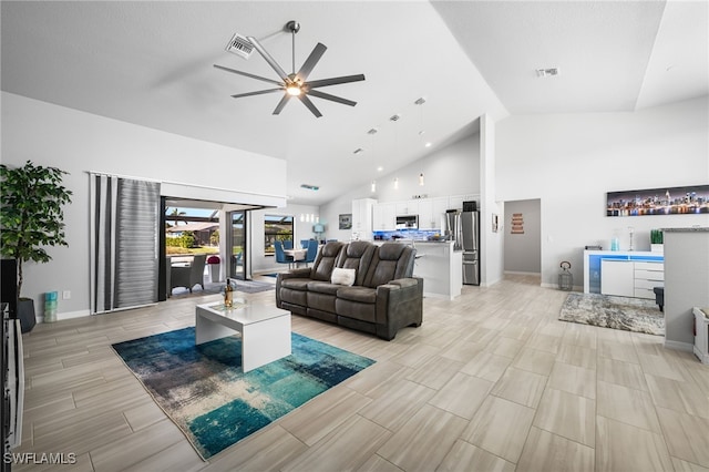 living room featuring high vaulted ceiling and ceiling fan