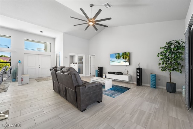 living room featuring high vaulted ceiling and ceiling fan