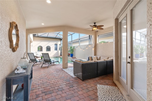 sunroom / solarium with ceiling fan