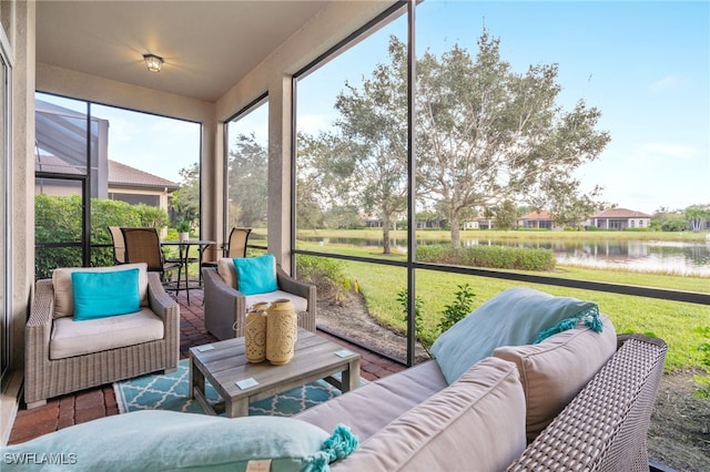 sunroom / solarium with a water view