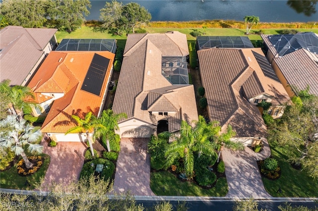 birds eye view of property featuring a water view