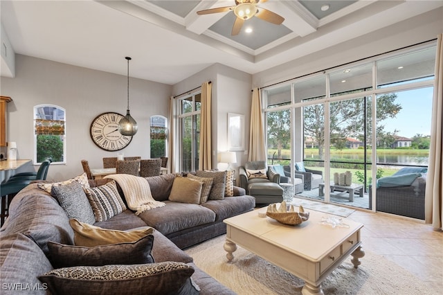 living room featuring a towering ceiling, beamed ceiling, coffered ceiling, ceiling fan, and a water view